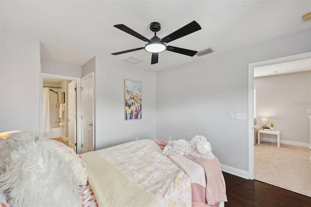 31646 Baymont Loop, Wesley Chapel, FL 33543 - bedroom with wood finished floors, a ceiling fan, and connected bathroom