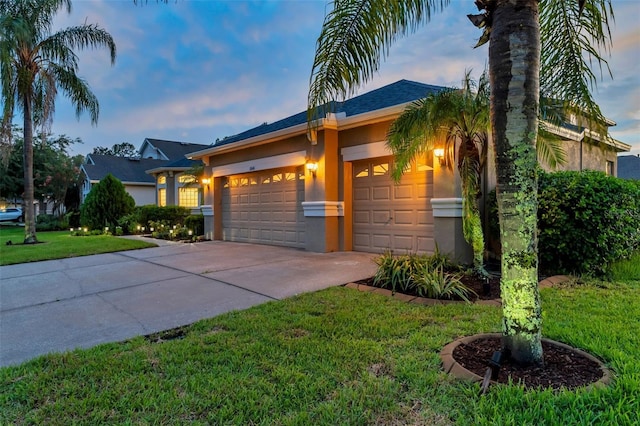31646 Baymont Loop, Wesley Chapel, FL 33543 - ranch-style home featuring stucco siding, an attached garage, driveway, and a front yard
