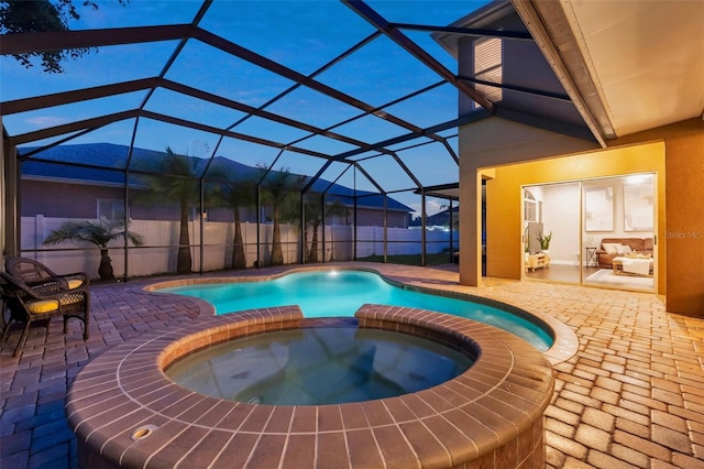31646 Baymont Loop, Wesley Chapel, FL 33543 - view of pool featuring a patio, a pool with connected hot tub, and glass enclosure
