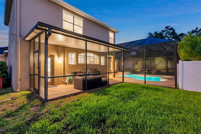 31646 Baymont Loop, Wesley Chapel, FL 33543 - rear view of house with stucco siding, an outdoor pool, a lanai, an outdoor living space, and a patio area
