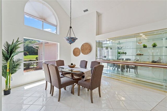 18561 Winding Oaks Blvd, Hudson, FL 34667 - dining space featuring high vaulted ceiling
