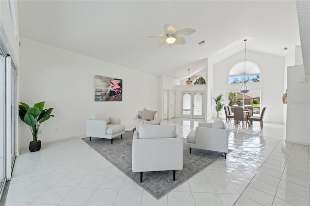 18561 Winding Oaks Blvd, Hudson, FL 34667 - living room featuring a ceiling fan, light tile patterned flooring, and high vaulted ceiling