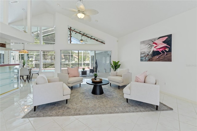 18561 Winding Oaks Blvd, Hudson, FL 34667 - living room with ceiling fan and high vaulted ceiling
