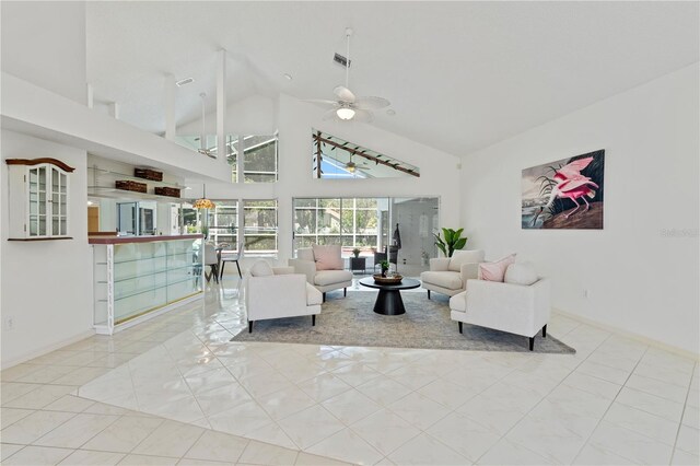 18561 Winding Oaks Blvd, Hudson, FL 34667 - tiled living room featuring high vaulted ceiling and ceiling fan