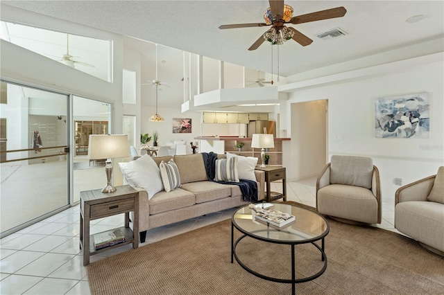 18561 Winding Oaks Blvd, Hudson, FL 34667 - living area featuring a ceiling fan, high vaulted ceiling, and light tile patterned floors