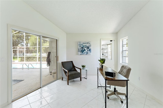 18561 Winding Oaks Blvd, Hudson, FL 34667 - office with healthy amount of natural light, a textured ceiling, and light tile patterned floors