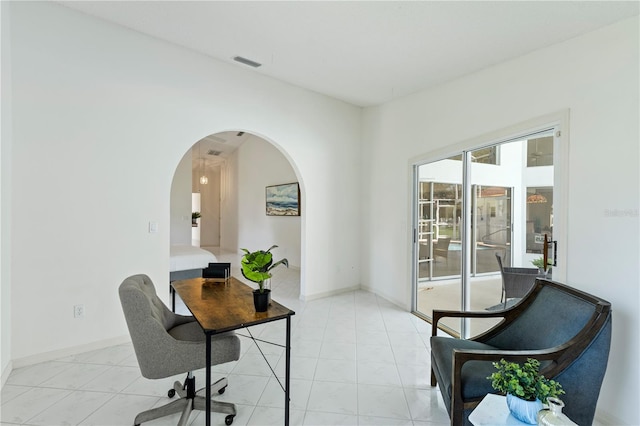 18561 Winding Oaks Blvd, Hudson, FL 34667 - office area featuring arched walkways and baseboards