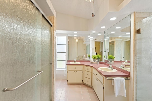 18561 Winding Oaks Blvd, Hudson, FL 34667 - bathroom featuring tile patterned flooring, a shower stall, double vanity, and recessed lighting