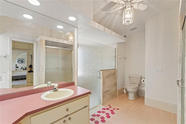 18561 Winding Oaks Blvd, Hudson, FL 34667 - bathroom featuring ensuite bath, a shower stall, a ceiling fan, vanity, and tile patterned flooring