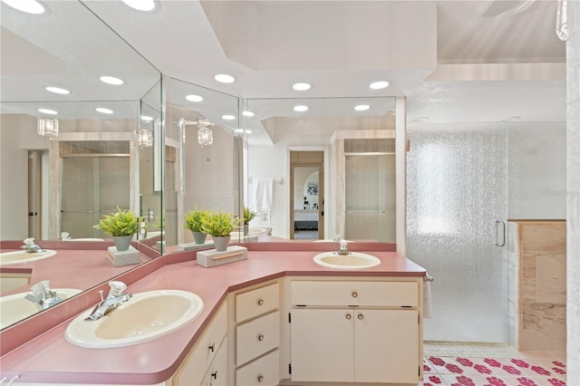 18561 Winding Oaks Blvd, Hudson, FL 34667 - bathroom featuring recessed lighting, a stall shower, and double vanity