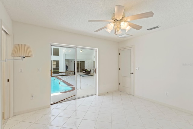 18561 Winding Oaks Blvd, Hudson, FL 34667 - unfurnished room featuring ceiling fan and a textured ceiling