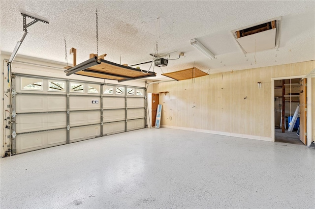 18561 Winding Oaks Blvd, Hudson, FL 34667 - garage with a garage door opener and wooden walls