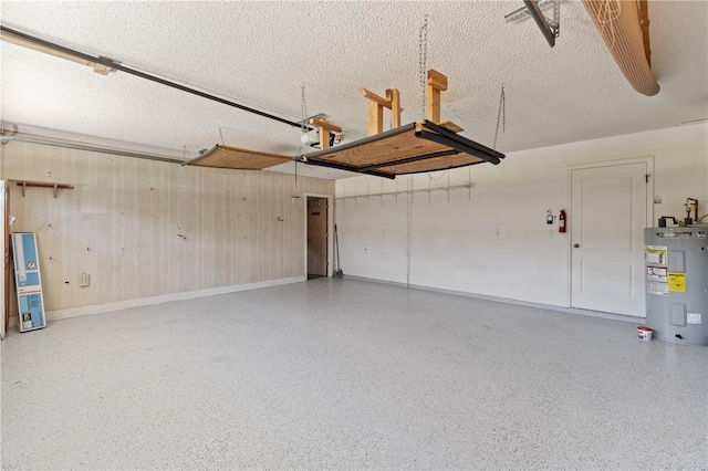18561 Winding Oaks Blvd, Hudson, FL 34667 - garage with water heater and wood walls