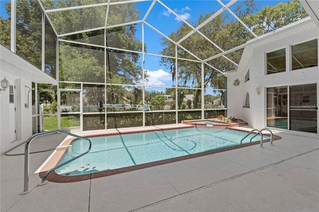 18561 Winding Oaks Blvd, Hudson, FL 34667 - view of swimming pool with a patio area, a lanai, and a pool with connected hot tub