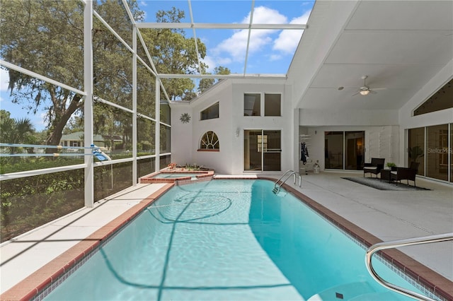 18561 Winding Oaks Blvd, Hudson, FL 34667 - view of pool with a ceiling fan, a patio area, a pool with connected hot tub, and a lanai