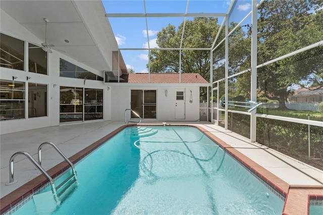 18561 Winding Oaks Blvd, Hudson, FL 34667 - swimming pool featuring a patio, a ceiling fan, and glass enclosure
