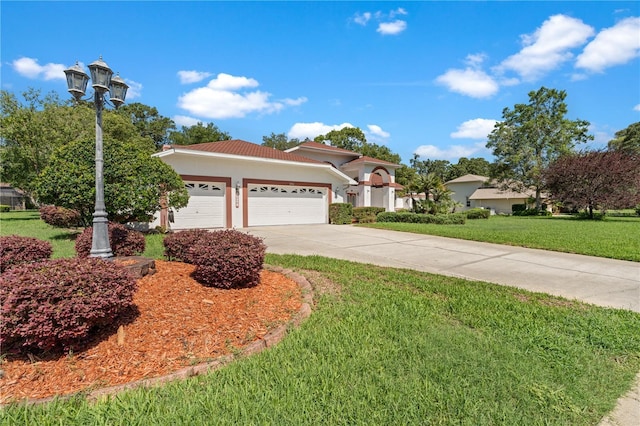 18561 Winding Oaks Blvd, Hudson, FL 34667 - view of front of property featuring concrete driveway, a garage, a front yard, stucco siding, and a tile roof