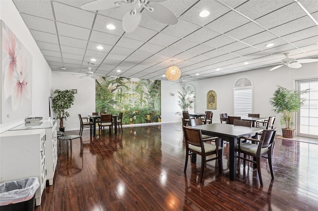 5200 Brittany Dr S Unit 1501, Saint Petersburg, FL 33715 - dining area featuring a ceiling fan, hardwood / wood-style floors, recessed lighting, and a paneled ceiling