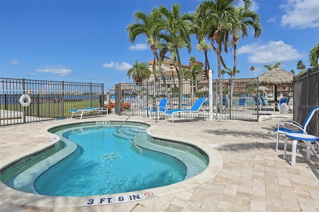 5200 Brittany Dr S Unit 1501, Saint Petersburg, FL 33715 - community pool featuring a patio area