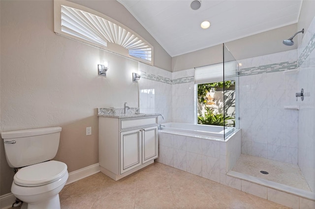 11225 4th St E, Treasure Island, FL 33706 - bathroom with a garden tub, vanity, vaulted ceiling, tile patterned flooring, and tiled shower