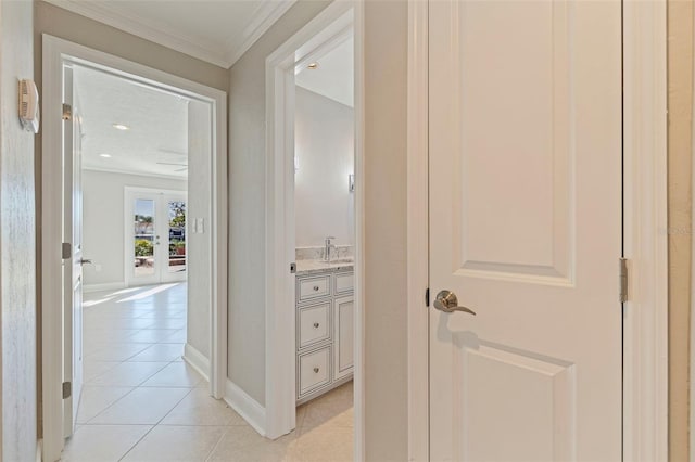 11225 4th St E, Treasure Island, FL 33706 - corridor featuring light tile patterned flooring, crown molding, and recessed lighting