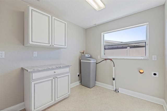 11225 4th St E, Treasure Island, FL 33706 - washroom featuring cabinet space and hookup for an electric dryer