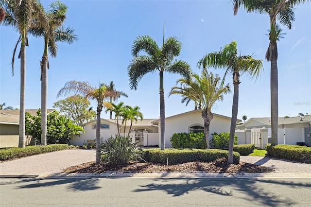 11225 4th St E, Treasure Island, FL 33706 - view of front of home with decorative driveway and stucco siding