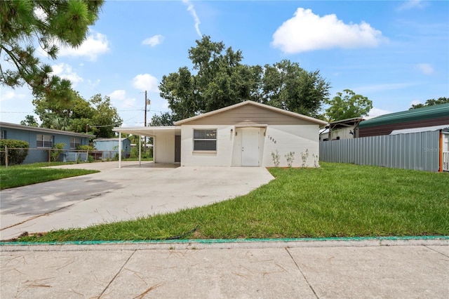 1826 Cadillac Cir, Tampa, FL 33619 - view of front facade featuring driveway and an attached carport
