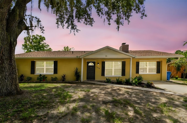 1320 Oak Valley Dr, Seffner, FL 33584 - ranch-style home with a chimney and stucco siding