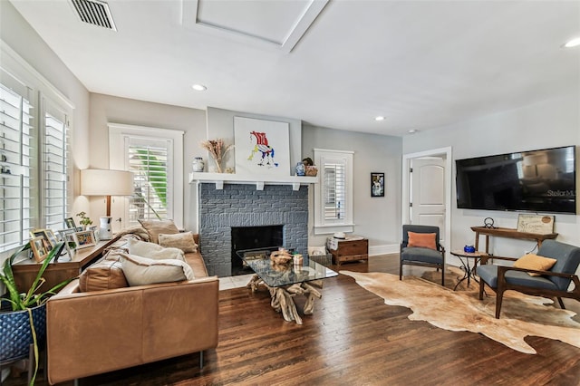 711 S Bungalow Ter, Tampa, FL 33606 - living room featuring wood finished floors, a fireplace, recessed lighting, and attic access