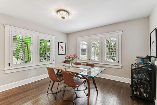 711 S Bungalow Ter, Tampa, FL 33606 - dining space with baseboards and dark wood-style flooring