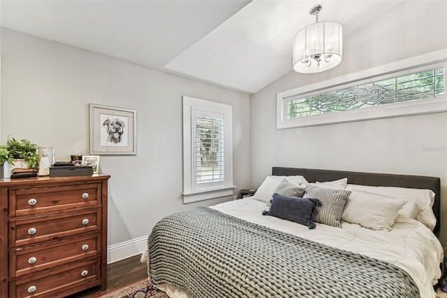 711 S Bungalow Ter, Tampa, FL 33606 - bedroom with a chandelier, dark wood finished floors, and lofted ceiling