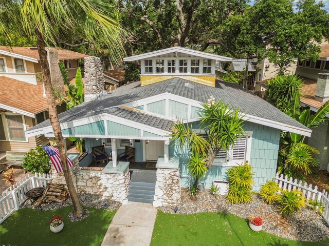 711 S Bungalow Ter, Tampa, FL 33606 - view of front of house with a shingled roof and covered porch