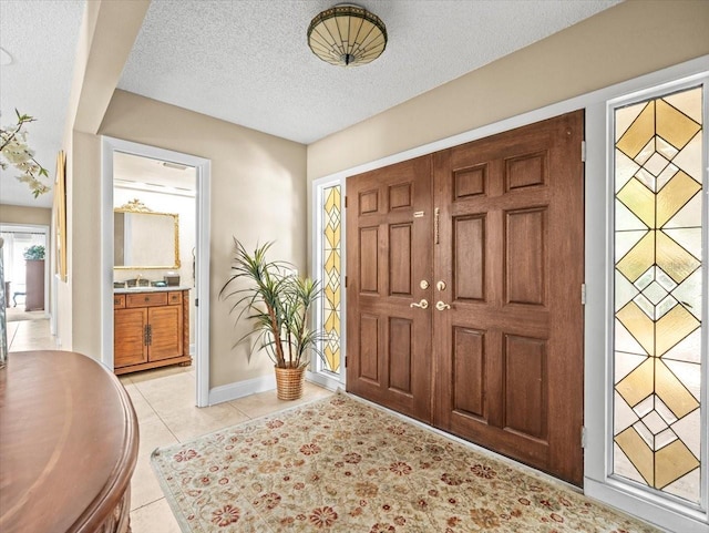 4209 Winding Willow Dr, Tampa, FL 33618 - foyer with a textured ceiling and light tile patterned floors