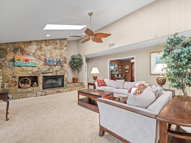 4209 Winding Willow Dr, Tampa, FL 33618 - living room featuring a skylight, a fireplace, ceiling fan, carpet, and a high ceiling