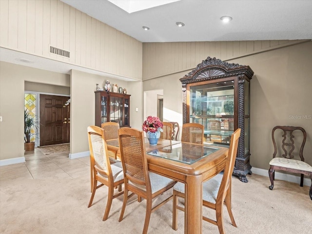 4209 Winding Willow Dr, Tampa, FL 33618 - dining space with light carpet, a skylight, and recessed lighting