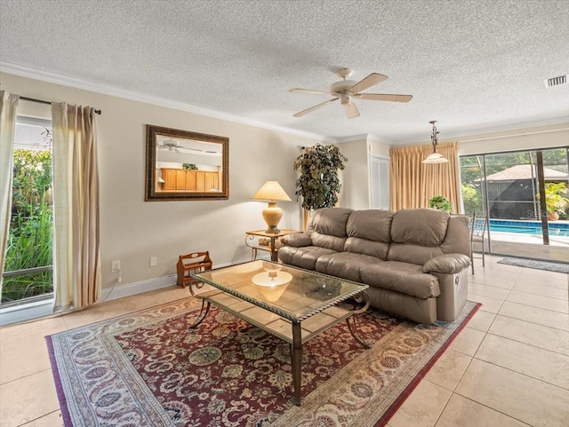 4209 Winding Willow Dr, Tampa, FL 33618 - living room featuring ceiling fan, light tile patterned floors, a textured ceiling, and ornamental molding