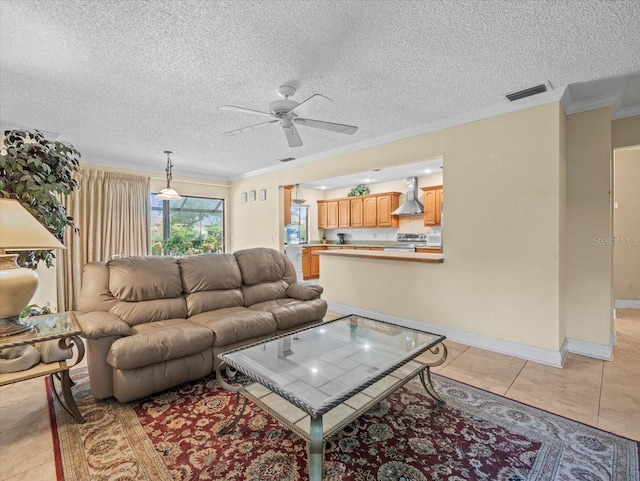 4209 Winding Willow Dr, Tampa, FL 33618 - living area with ceiling fan, ornamental molding, a textured ceiling, and light tile patterned floors