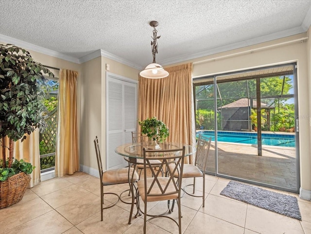 4209 Winding Willow Dr, Tampa, FL 33618 - dining room featuring light tile patterned flooring, crown molding, and a textured ceiling