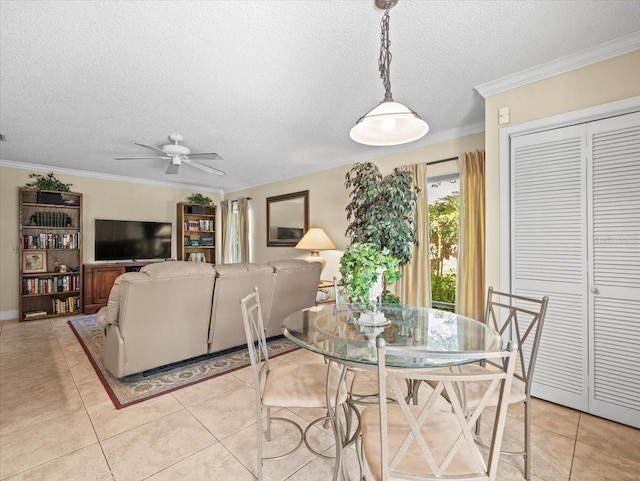 4209 Winding Willow Dr, Tampa, FL 33618 - dining area with ceiling fan, light tile patterned floors, a textured ceiling, and crown molding
