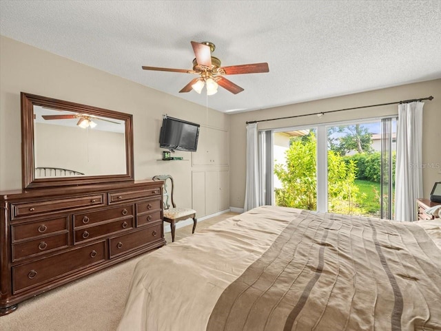 4209 Winding Willow Dr, Tampa, FL 33618 - carpeted bedroom featuring a textured ceiling, access to outside, and ceiling fan
