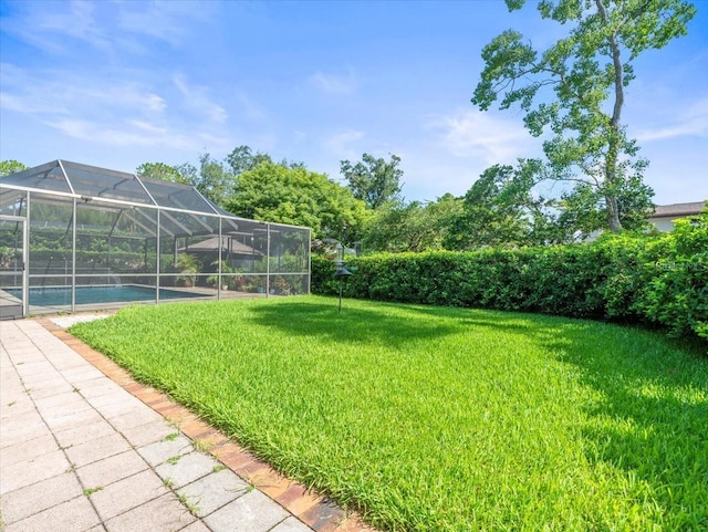 4209 Winding Willow Dr, Tampa, FL 33618 - view of grassy yard featuring an outdoor pool and glass enclosure
