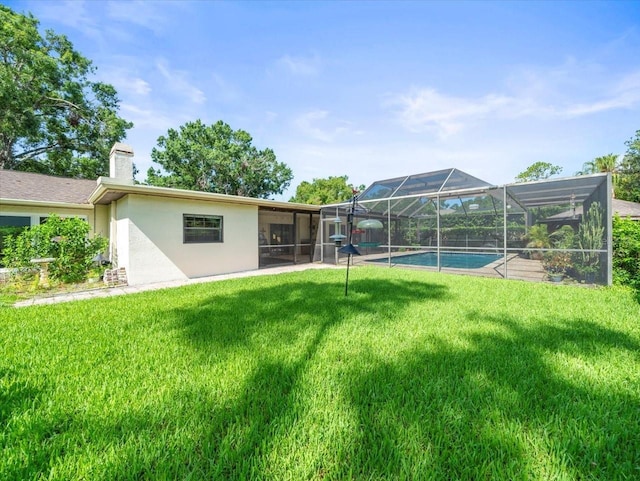 4209 Winding Willow Dr, Tampa, FL 33618 - view of grassy yard featuring an outdoor pool and glass enclosure