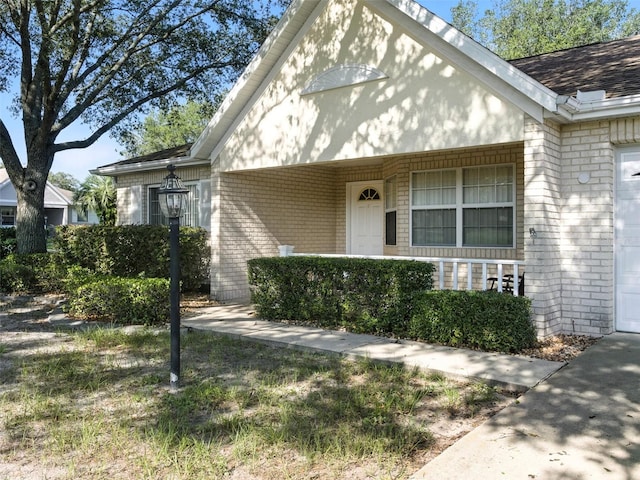 9859 SW 97th St, Ocala, FL 34481 - view of front of home featuring brick siding