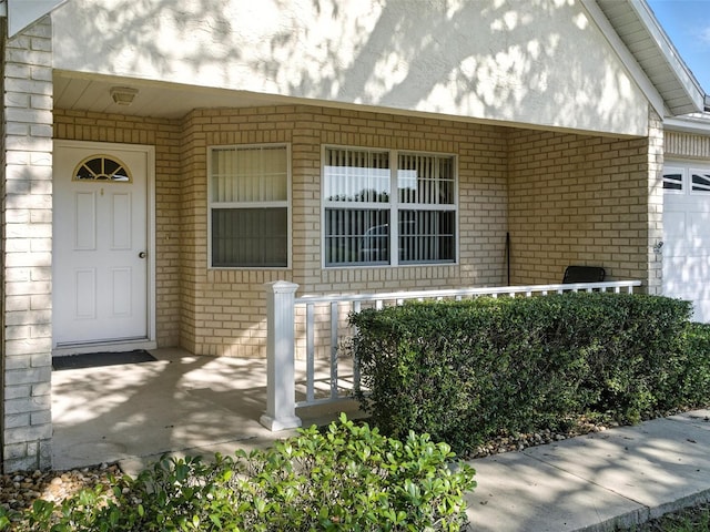 9859 SW 97th St, Ocala, FL 34481 - entrance to property featuring brick siding and a porch