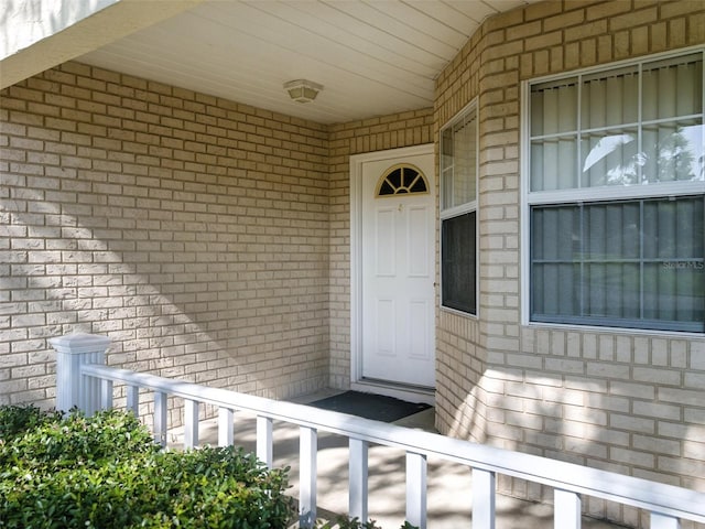 9859 SW 97th St, Ocala, FL 34481 - doorway to property with brick siding and covered porch