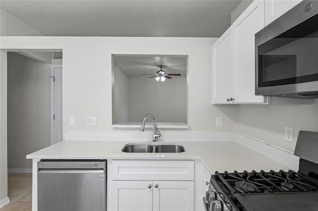 456 Summer Sails Dr, Valrico, FL 33594 - kitchen featuring stainless steel appliances, a ceiling fan, white cabinets, light tile patterned floors, and light countertops