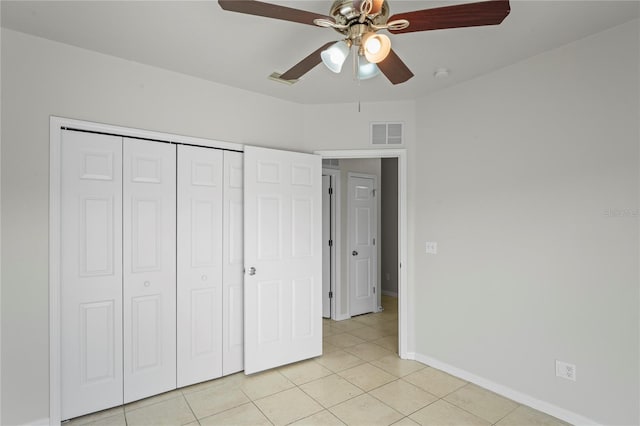 456 Summer Sails Dr, Valrico, FL 33594 - unfurnished bedroom featuring light tile patterned floors, a closet, and a ceiling fan