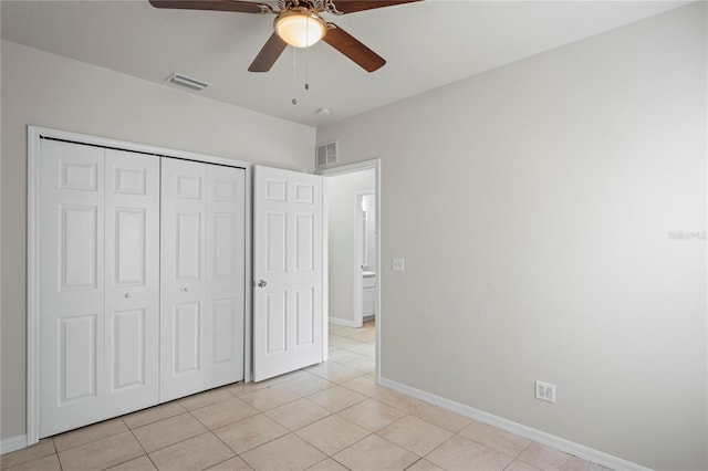 456 Summer Sails Dr, Valrico, FL 33594 - unfurnished bedroom featuring light tile patterned floors, a closet, and a ceiling fan