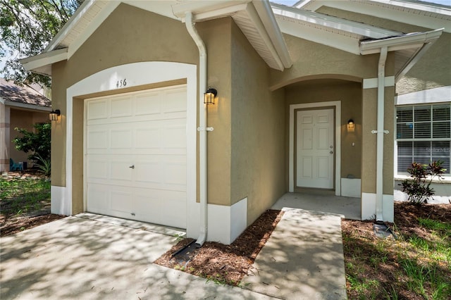 456 Summer Sails Dr, Valrico, FL 33594 - entrance to property featuring stucco siding and an attached garage